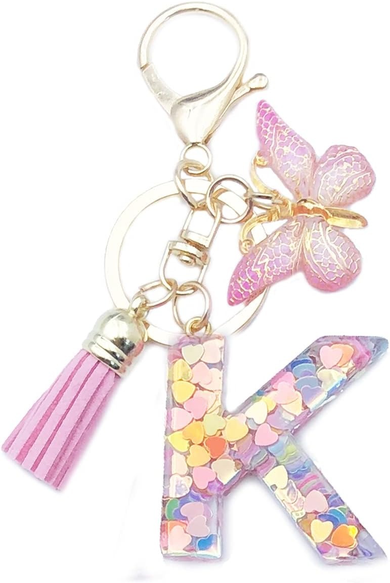 Keychain with butterfly, tassel, and letter 'K' charm